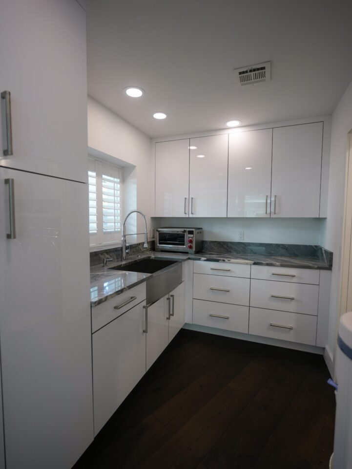glossy white cabinetry prep area