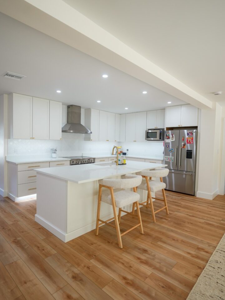 white shaker kitchen island brass hardware